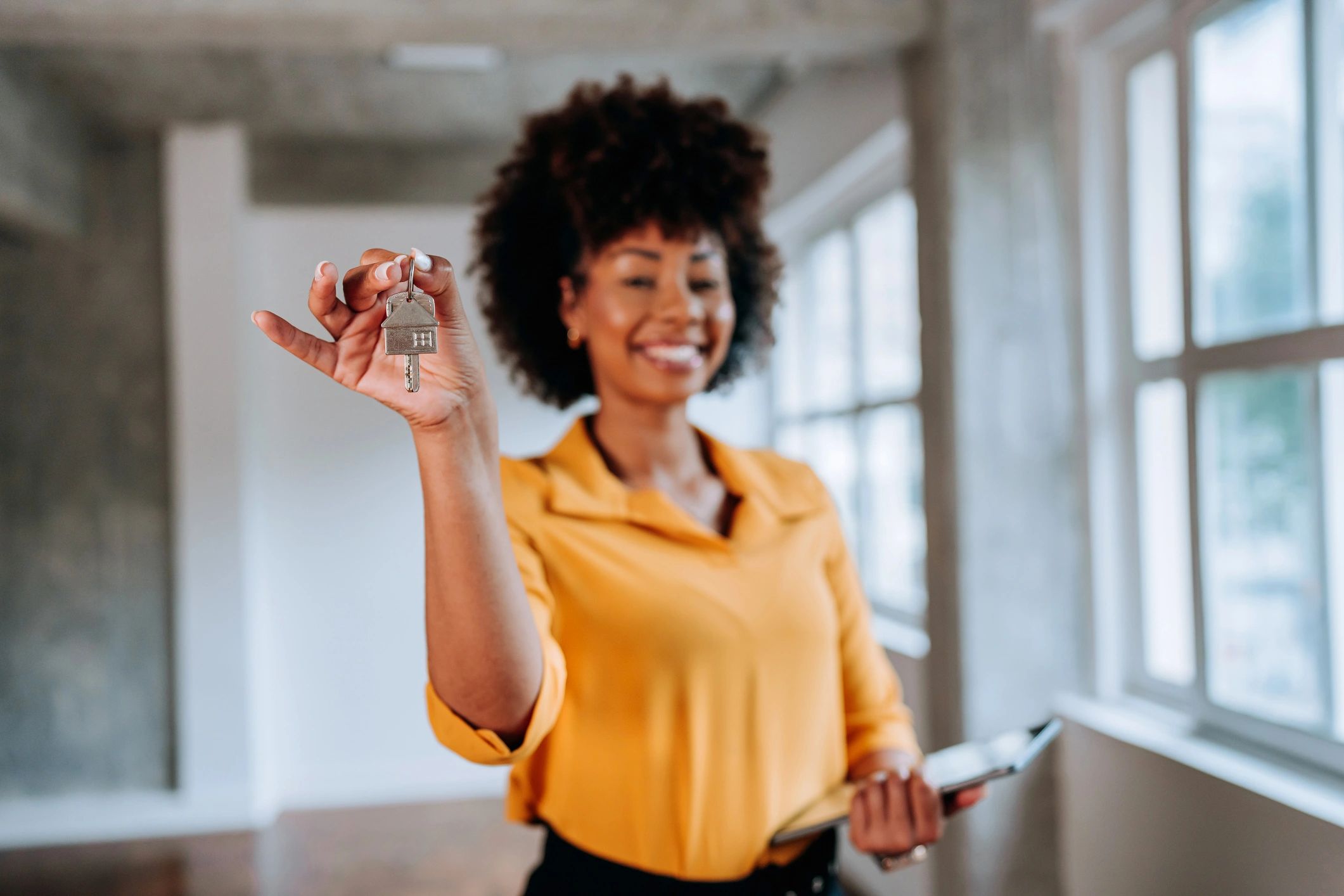 Real estate agent holding a house key