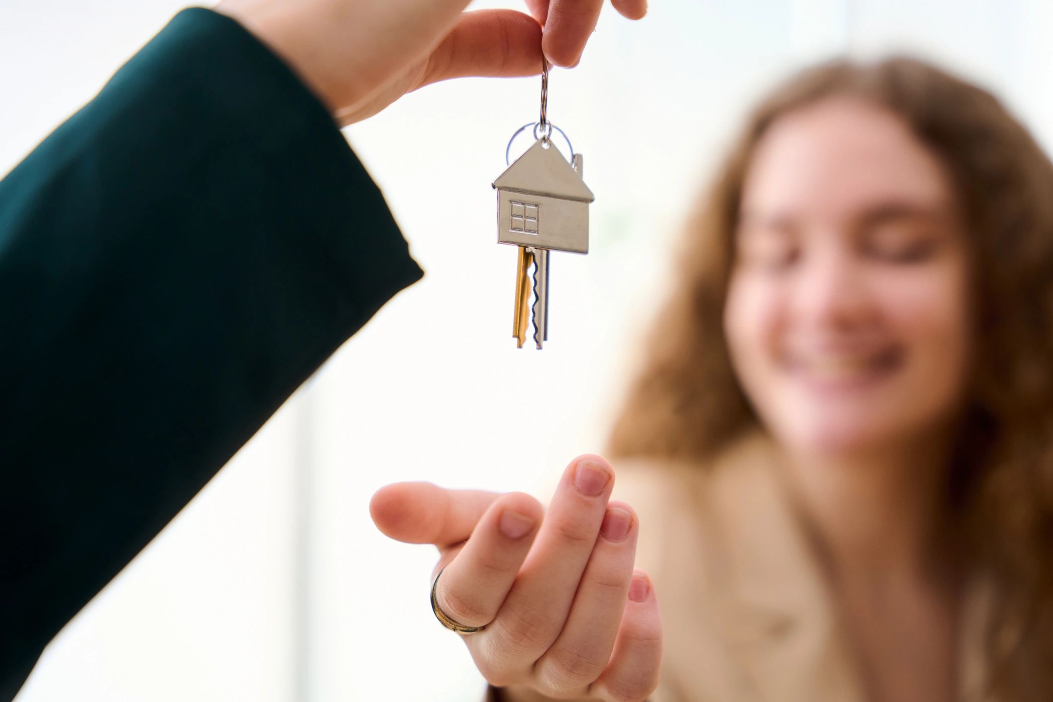 House keys being handed over during a real estate transaction